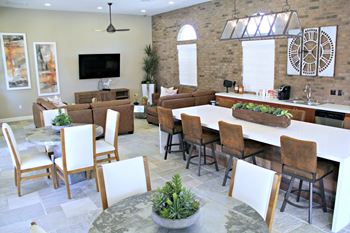Clubhouse with kitchen and island, quartz counters and stainless steel appliances